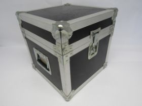 A metal bound flight case with handles, approx. 37cm square