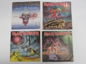 IRON MAIDEN: Four 7" singles to include 'Twighlight Zone' (EMI 5145, red vinyl), 'Run To The