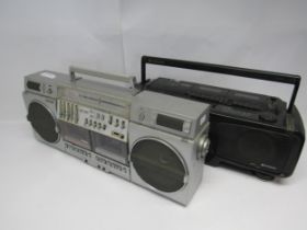 A Sharp GF-575 stereo radio cassette ghetto blaster and a Hitachi CX-W700 portable CD radio cassette