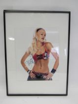 An autographed 8" x 10" publicity photograph of Gwen Stefani (No Doubt), framed