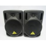 A pair of Behringer Eurolive B208D active 20 watt PA speakers and stands