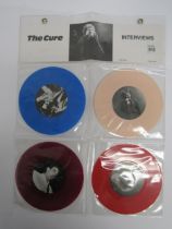 THE CURE: 'Interviews' set of four coloured vinyl 7" records in wall hanging plastic display (CURE