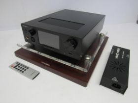 An Oppo HA-1 headphone amplifier on wood and perspex glass plinth, with remote control and leads,