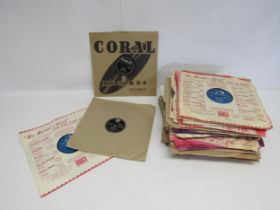 A collection of assorted 78s including numerous Rock n Roll titles, artists include Bill Haley,