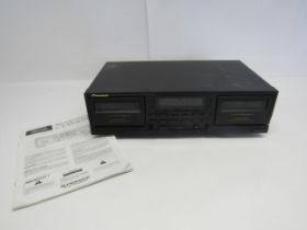 A Pioneer CT-W200R stereo double cassette deck with instruction manual