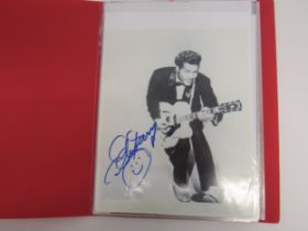 Rock N Roll autographs- A folder containing twelve hand signed items, some on 8" x 10" photos,