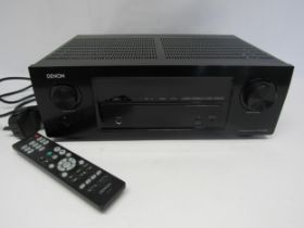 A Denon AVR-X540BT AV surround receiver with remote control and lead