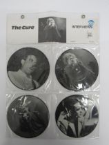 THE CURE: 'Interviews' set of four 7" picture discs in wall hanging clear plastic display, each
