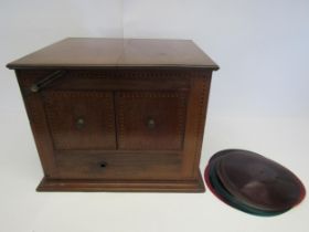 A vintage wind-up gramophone in inlaid mahogany casing, fitted with 'The Diaphone' wooden horn