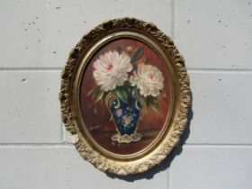STEPHEN WALKER (1900-2004) An oval gilt framed oil on board, Floral still life. Signed bottom right.