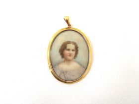 EDWARD FESSER (American b.1863) A miniature watercolour on oval ivory panel, portrait of a young