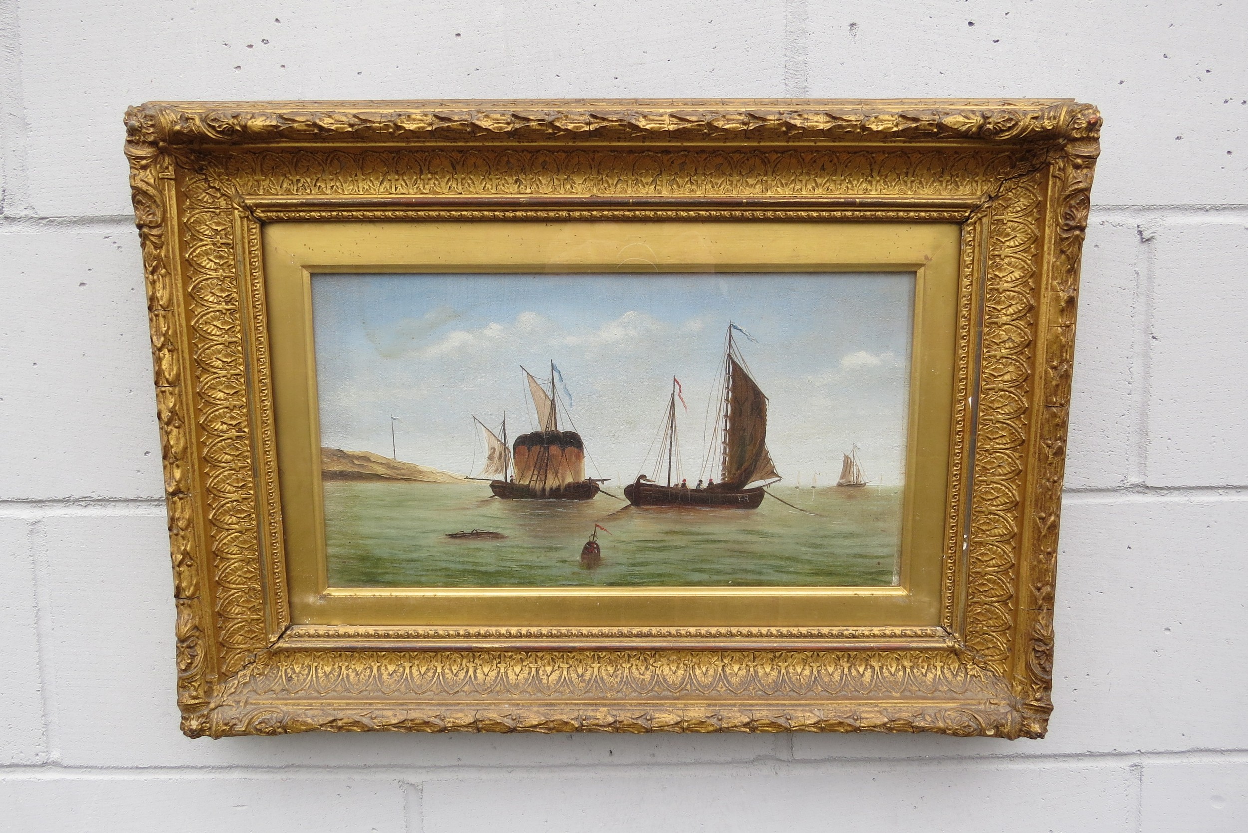 A 19th Century oil on canvas of figures on boats, unsigned, ornate gilt frame and glazed. Image size