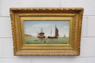 A 19th Century oil on canvas of figures on boats, unsigned, ornate gilt frame and glazed. Image size
