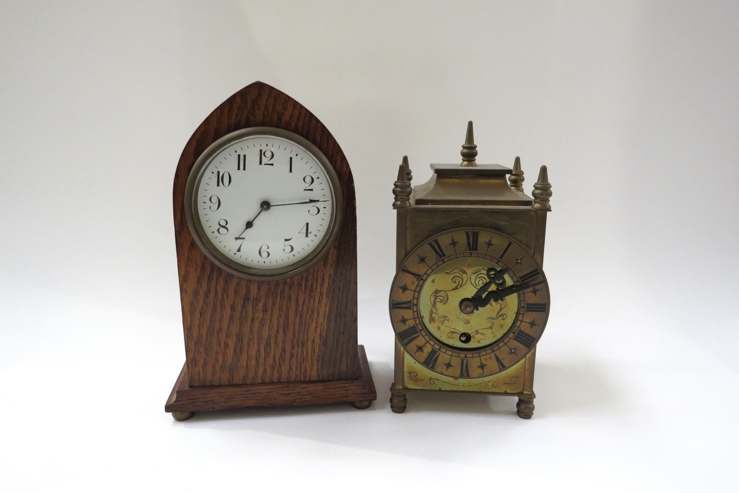 An Edwardian lancet form oak timepiece with a brass cased timepiece (2)