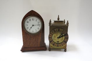 An Edwardian lancet form oak timepiece with a brass cased timepiece (2)