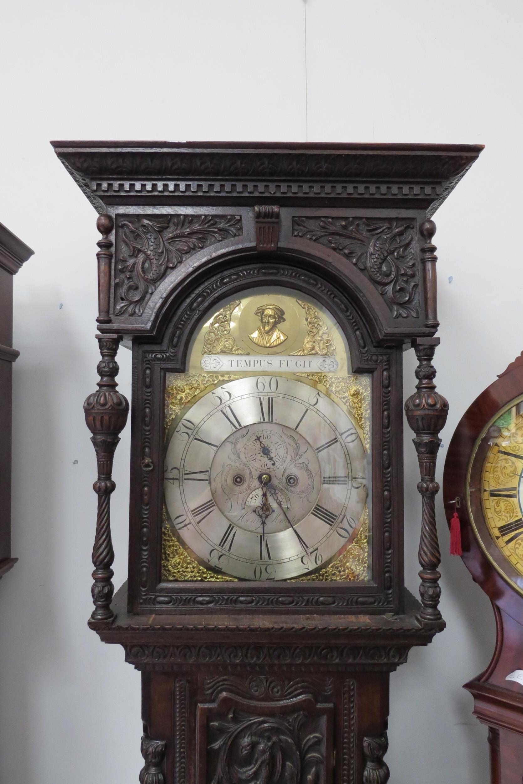 An 18th Century heavily carved oak longcase clock with silvered Roman chapter ring, date and seconds - Image 4 of 8