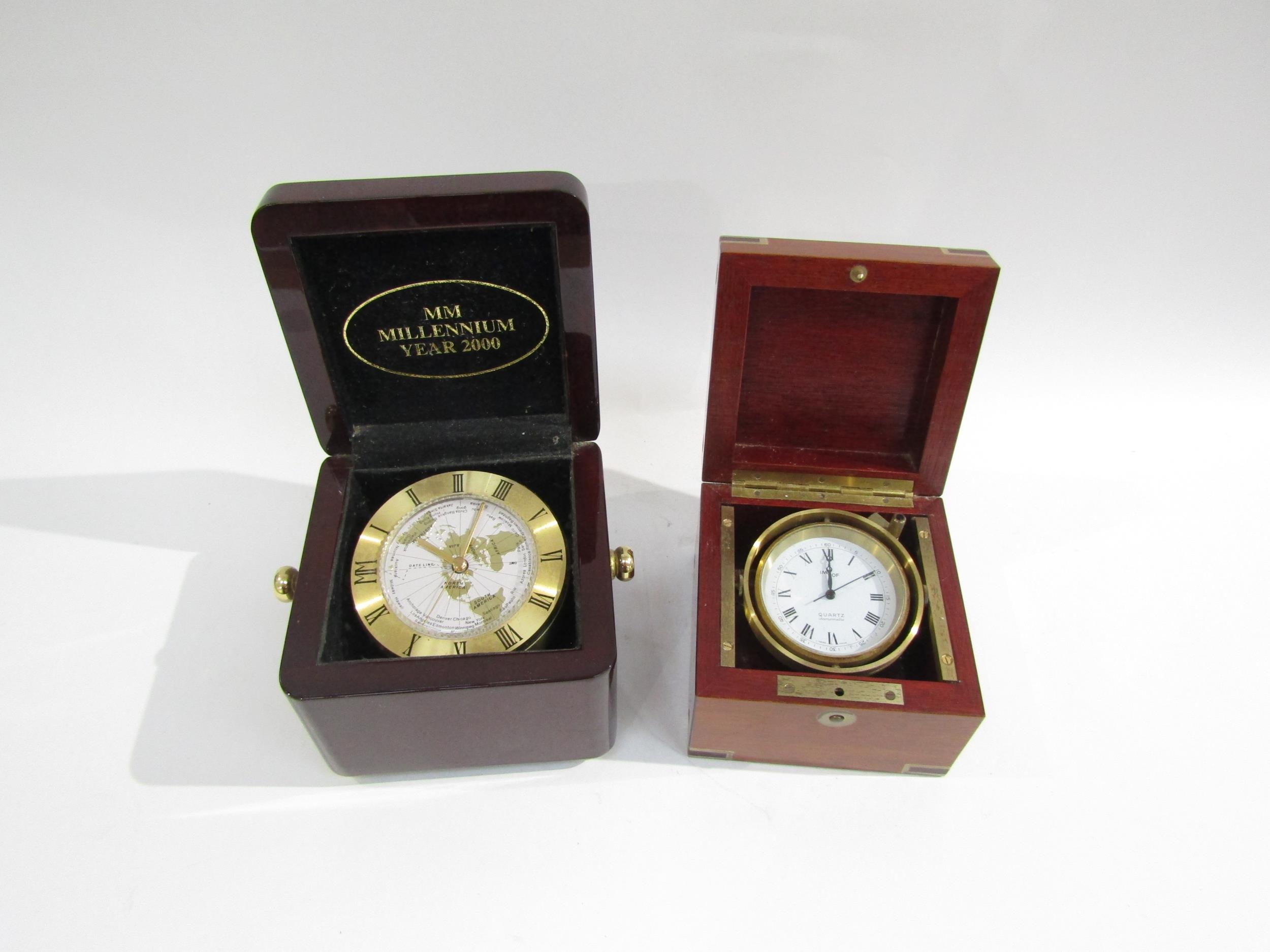 A pair of marine chronometers - one an Imhof quartz Swiss with Roman numerals and outer seconds