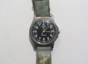 A Cabot Watch Company (CWC) military Quartz wristwatch, black dial with numerals. Back cover