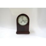 A French domed top mantel clock with white face Roman numerals. 24cm high