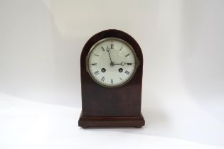 A French domed top mantel clock with white face Roman numerals. 24cm high