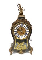 A 19th Century French bracket clock of balloon form with decorative ormolu mounts. Brass dial with