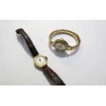 Two 9ct gold cased Smiths Astral ladies wristwatches, one on leather strap, other on 9ct gold