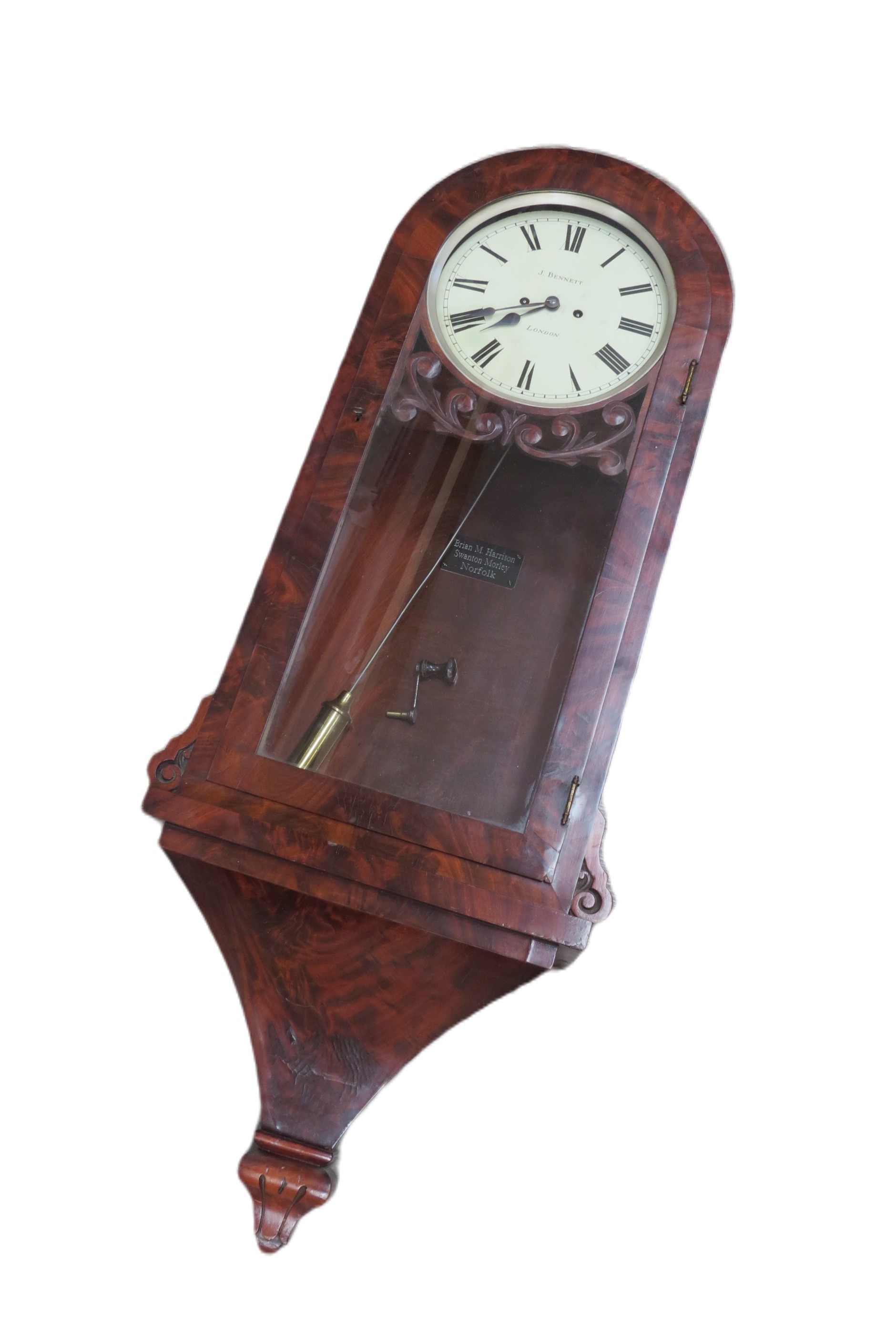 A mid 19th Century flame mahogany and glazed door wall clock, painted metal Roman dial (10" dial)