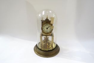 A Gustav Becker brass anniversary clock under plastic dome, 30cm tall