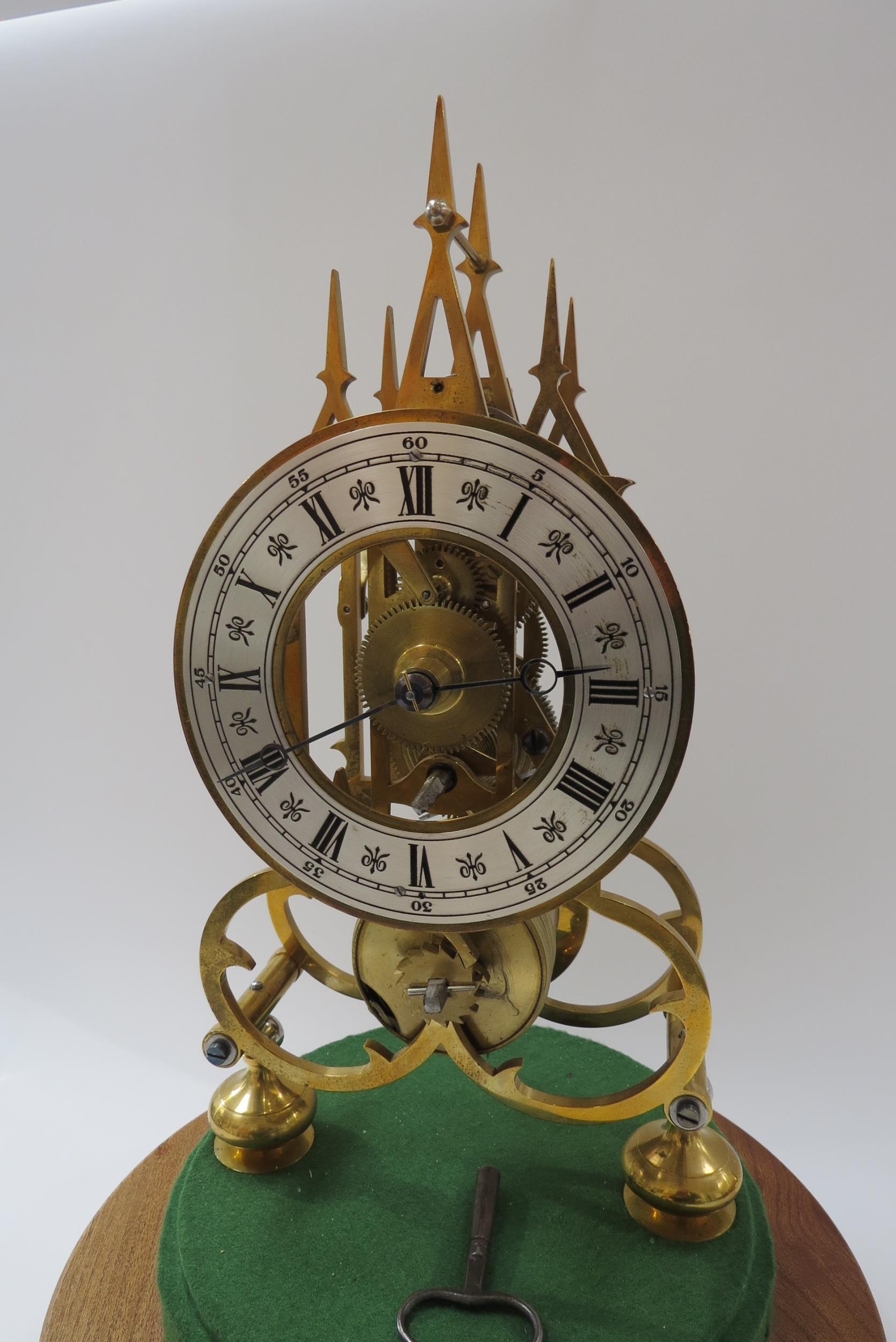 A 20th Century single fusee skeleton timepiece of Gothic design under glass dome. Roman silvered - Image 2 of 4