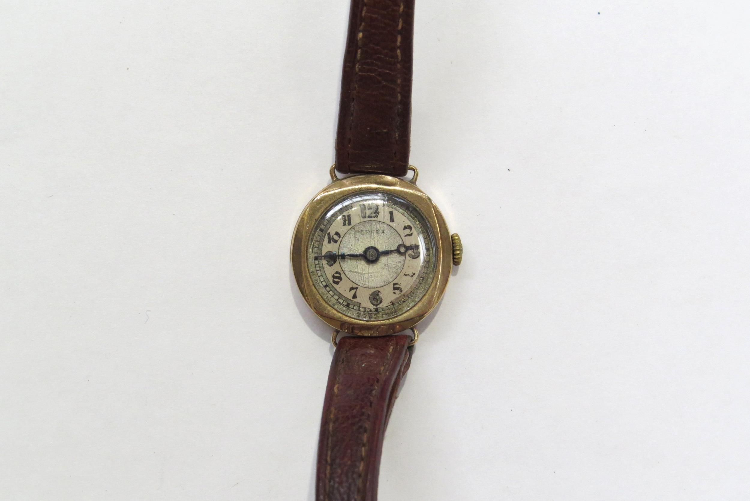 A 9ct gold cased Perfex ladies wristwatch on leather strap