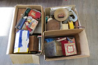 Three boxes of various watch parts including a large quantity of balance staffs, stems, wheels,