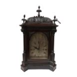 A late 19th Century mahogany cased bracket clock with arched silvered Roman dial signed JW Benson,