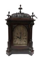 A late 19th Century mahogany cased bracket clock with arched silvered Roman dial signed JW Benson,