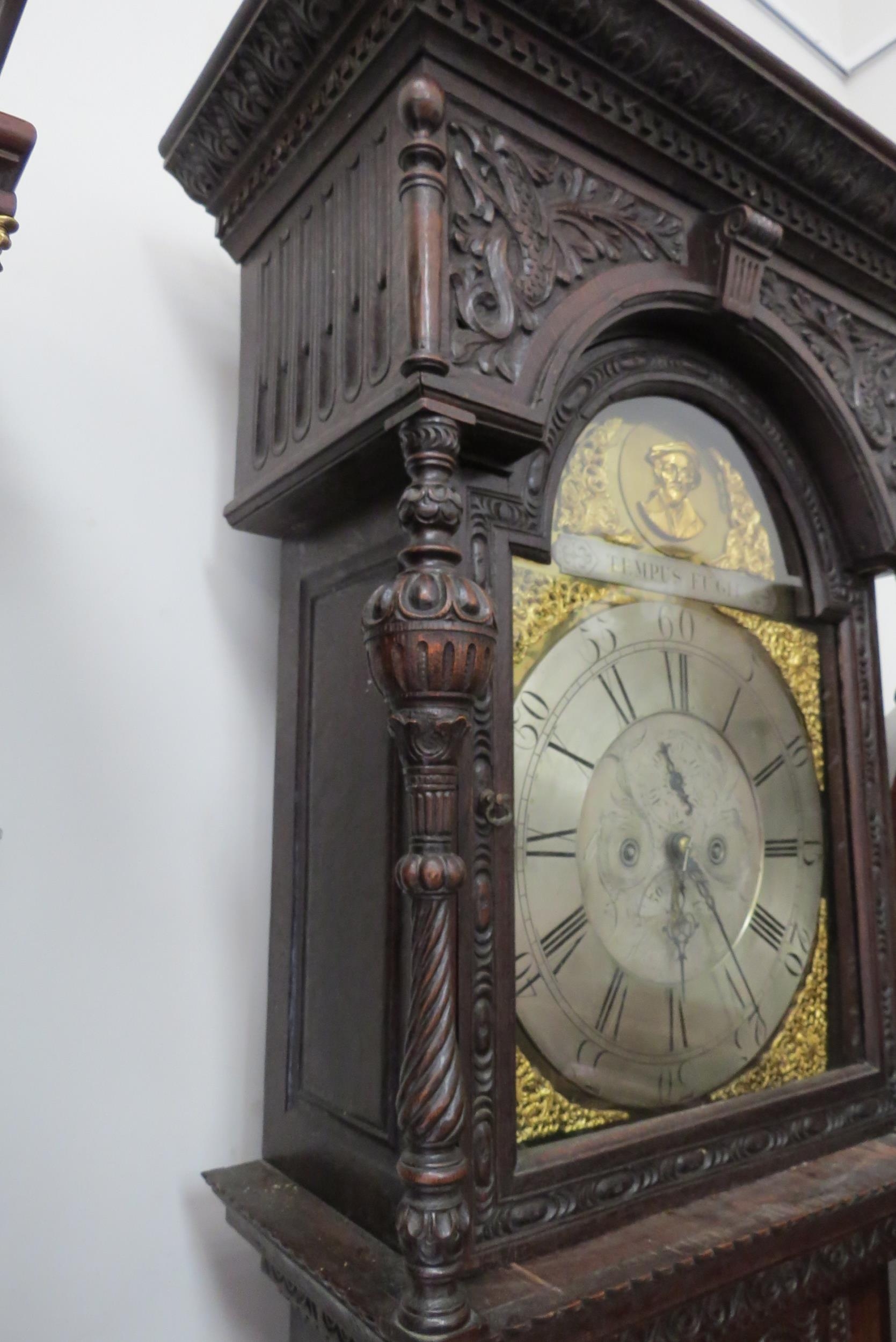 An 18th Century heavily carved oak longcase clock with silvered Roman chapter ring, date and seconds - Image 7 of 8