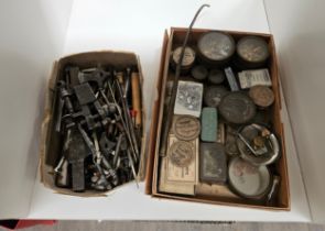 A collection of watch parts and various vintage watch tools