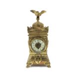 A French timepiece in highly decorative brass case, Arabic enamelled chapter ring, with pendulum.