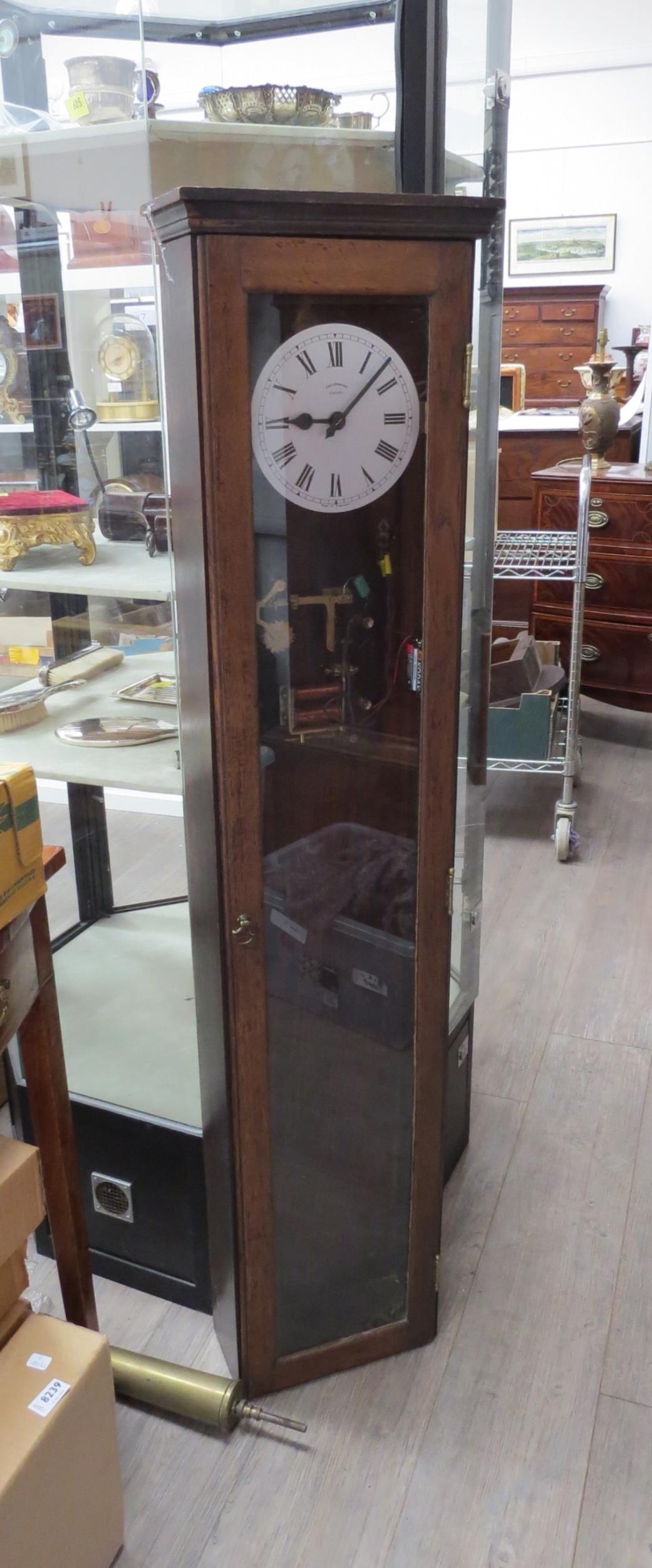 A Synchronome electric longcase regulator clock with Roman numeral and silvered dial with outer