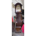 An 18th Century oak longcase clock with brass arch dial and silvered Roman chapter ring signed