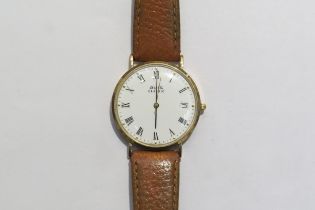 A gents Avia Classic 9ct gold watch with leather strap