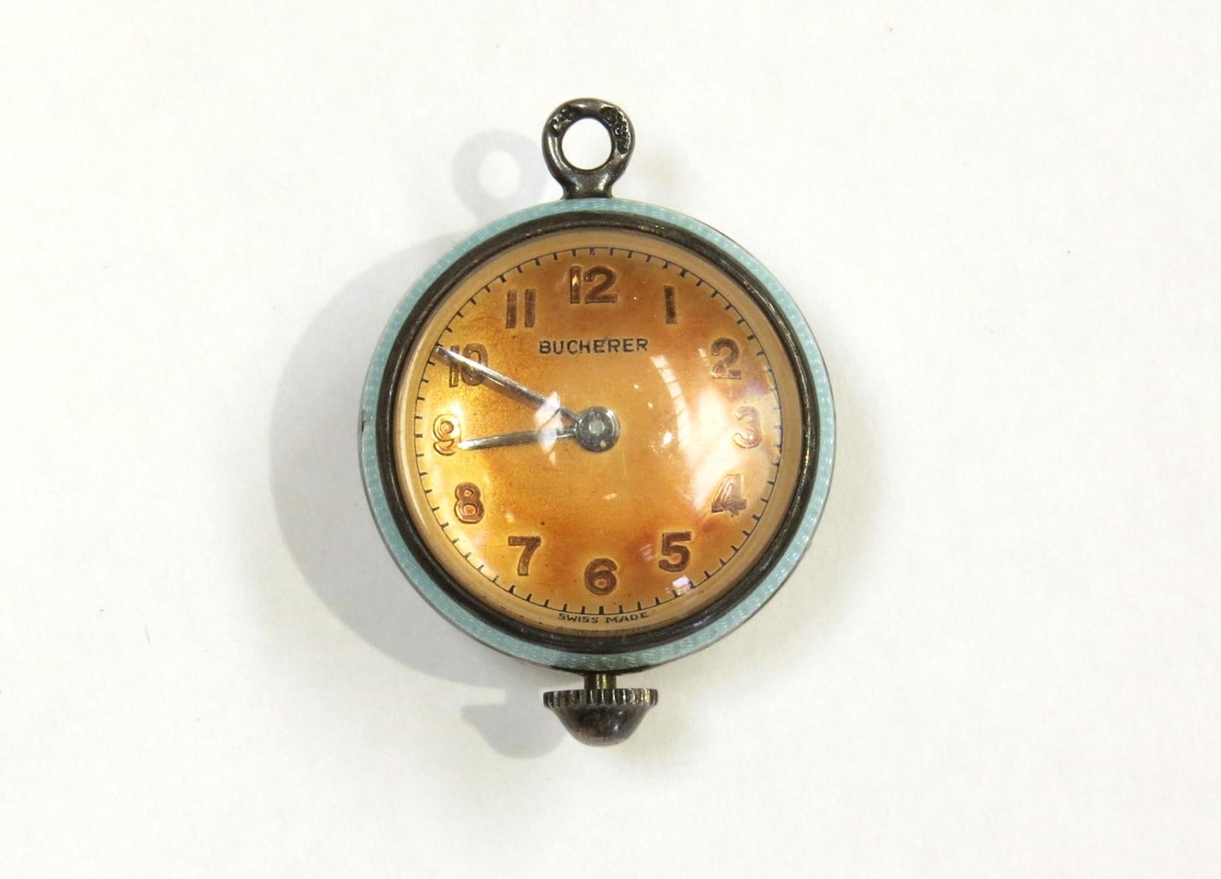 A Bueherer globe shaped pendant watch with guilloche decoration, visible movement, approximately 2.