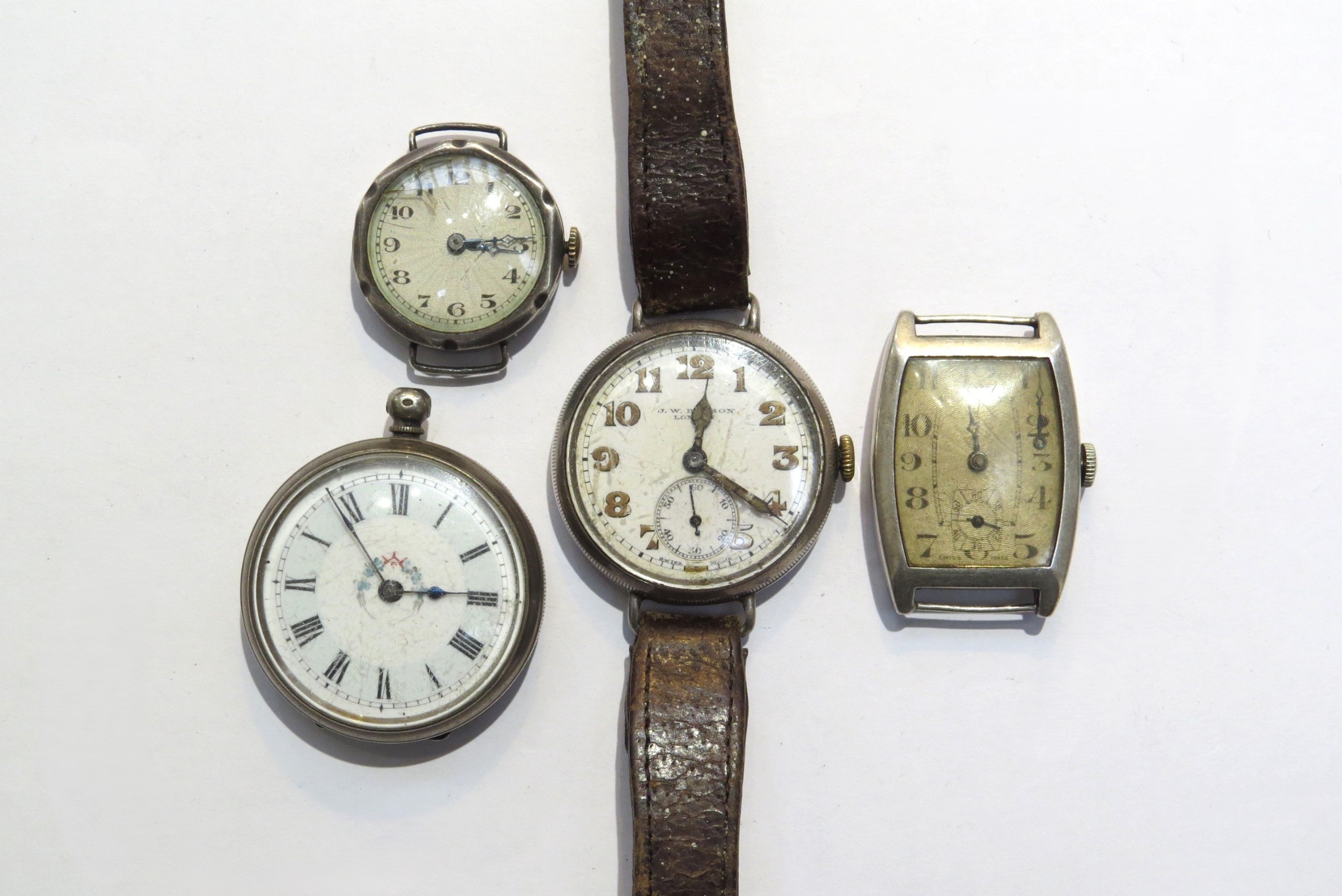 A group of four silver watches inclduing a J. W. Benson, London with subsidiary seconds dial on