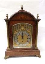 A late 19th Century oak and inlaid bracket clock with silvered Roman chapter ring over gilded