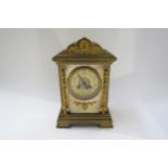 A late 19th/early 20th Century brass cased French two train mantel clock with arabic numerals,