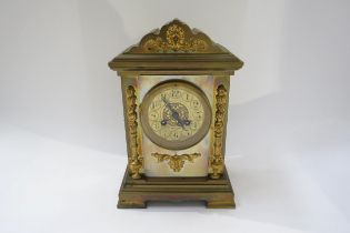 A late 19th/early 20th Century brass cased French two train mantel clock with arabic numerals,