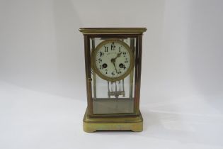 A four glass French two train mantel clock with mercury pendulum. Striking on a coiled gong. 22.