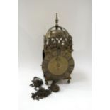 A lantern clock with single hand and roman silvered dial, signed Thos. Moore. Ipswich. 18th