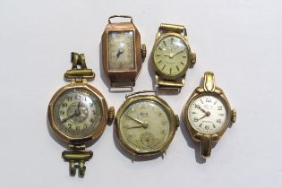 Five 9ct gold cased ladies wristwatchs with no straps, 37g gross weight