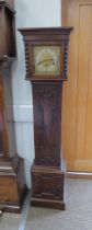 An early 20th Century oak cased striking and chiming grandmother clock with mainspring driven