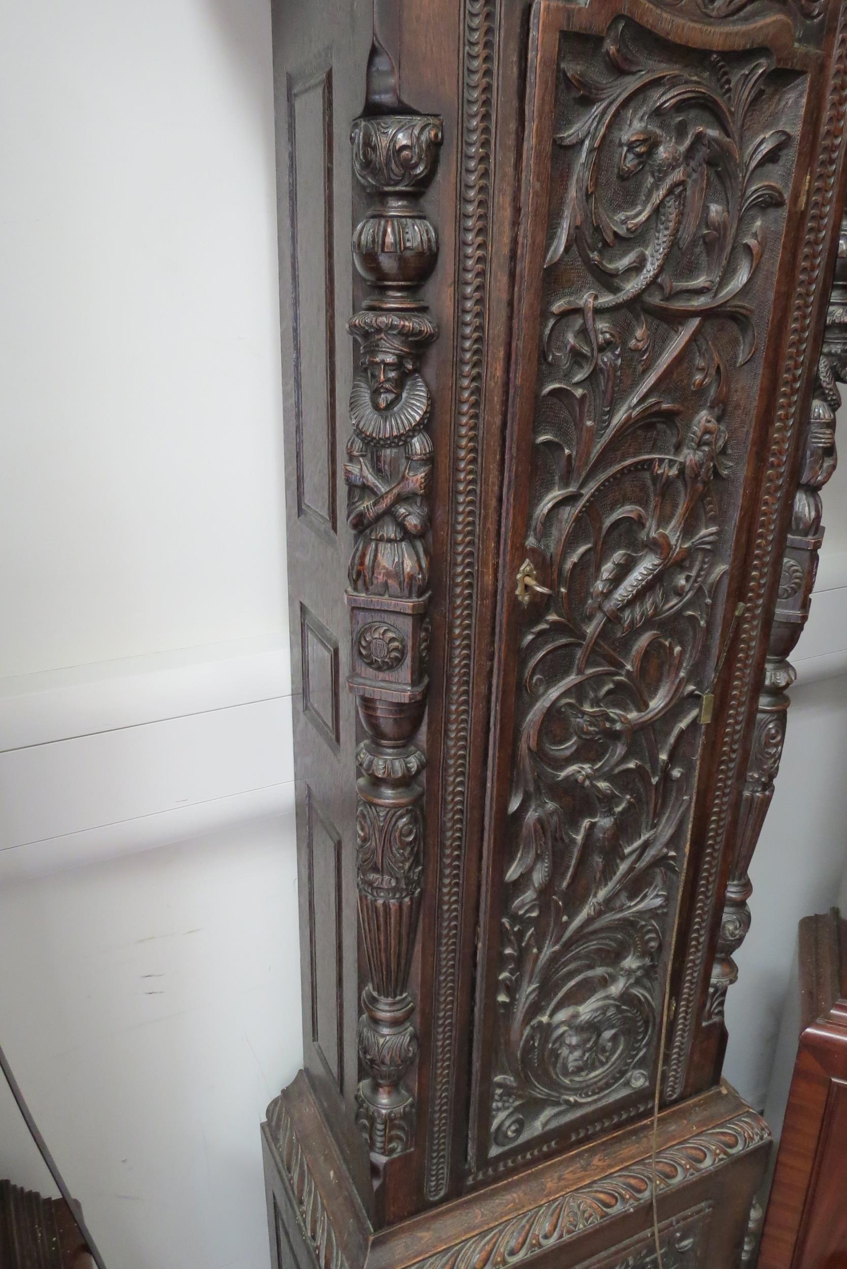 An 18th Century heavily carved oak longcase clock with silvered Roman chapter ring, date and seconds - Image 6 of 8