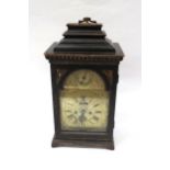 An 18th Century bracket clock in ebonised case. Roman brass chapter ring with applied spandrels